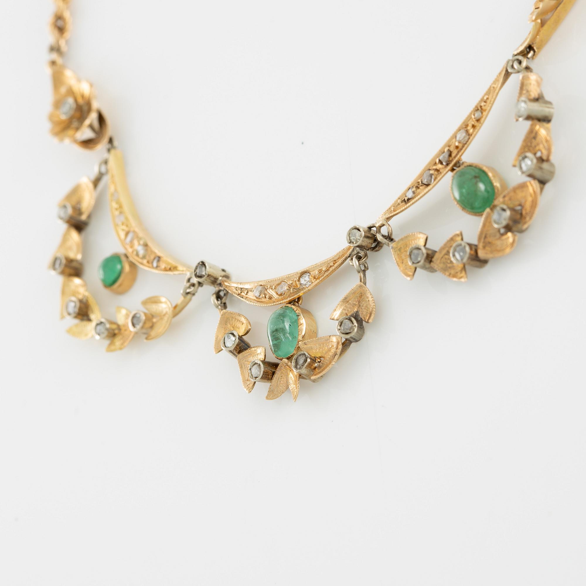 Necklace and bracelet in with floral motif set with cabochon-cut emeralds and rose-cut diamonds.