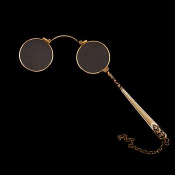 LORGNETTE, Gulmetall och 14 k guld, omkring år 1900. Total vikt ca 24 gram.