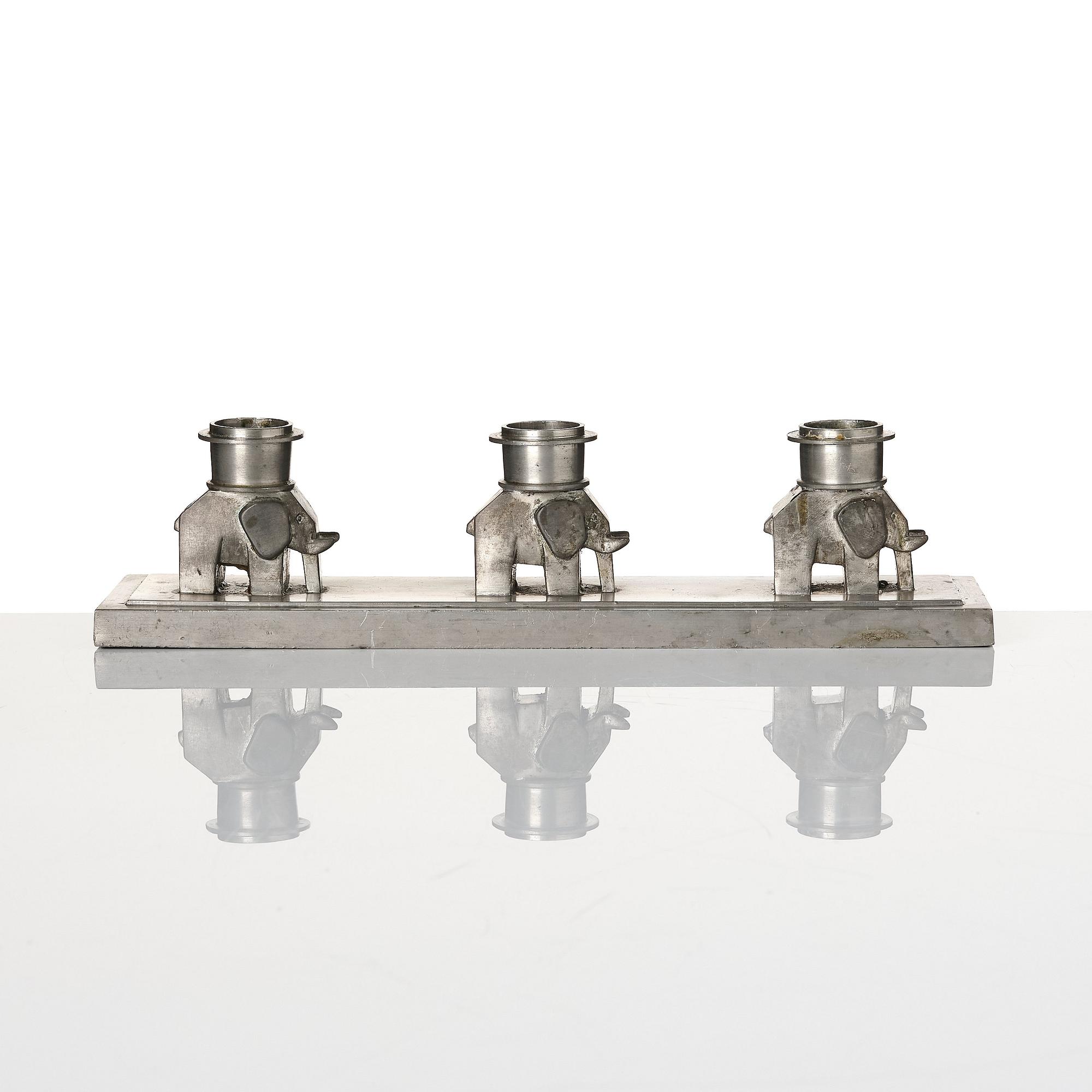 Lidvard Hallset, a pewter candelabrum for three candles, model "1545", Firma Svenskt Tenn, Stockholm 1930.