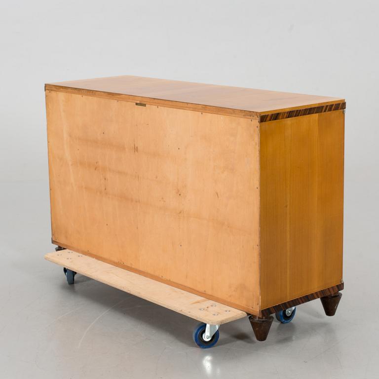 A "MODEL OK" SIDEBOARD DESIGNED BY AXEL EINAR HJORTH FOR NORDISKA KOMPANIET.