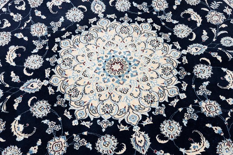 A Nain rug, diameter 243 cm.