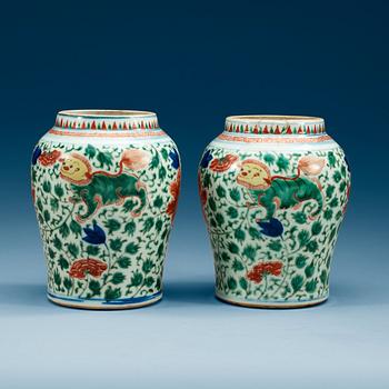 1674. A pair of Transitional Wucai jars, 17th Century.