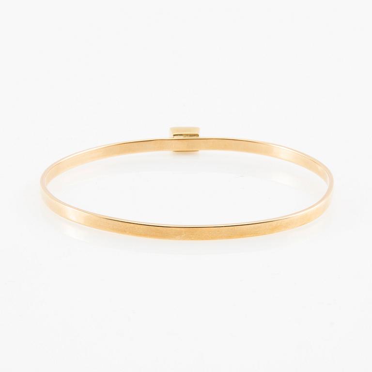 Wiwen Nilsson, Armring 18K gold with a synthetic white spinel, Lund 1967.