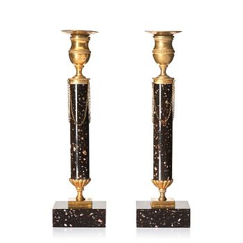 140. A pair of late Gustavian porphyry and gilt brass candlesticks, circa 1800.