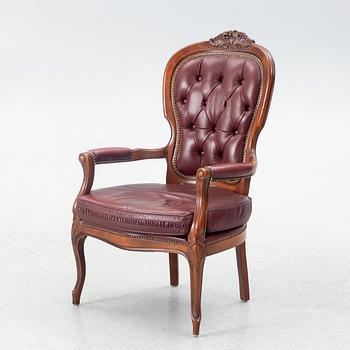 A Rococo style armchair, second half of the 20th Century.