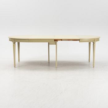 A Gustavian dining table with six chairs. Åmells dated 1974.