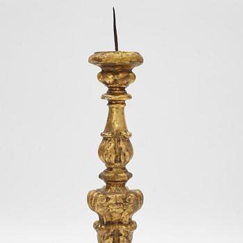 A giltwood Baroque pricket candlestick, circa 1700.