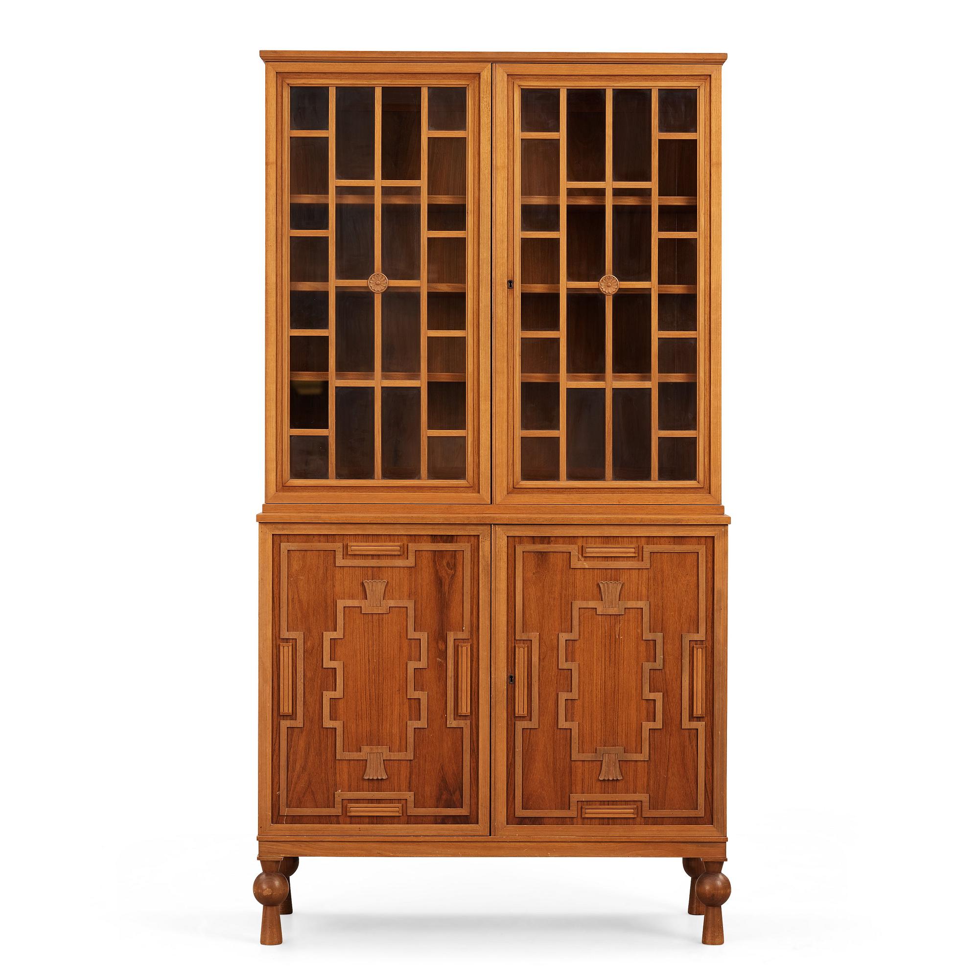 A Swedish Grace mahogany showcase cabinet, reportedly a win at the Stockholm Cabinetmaker's association lottery, 1920's.