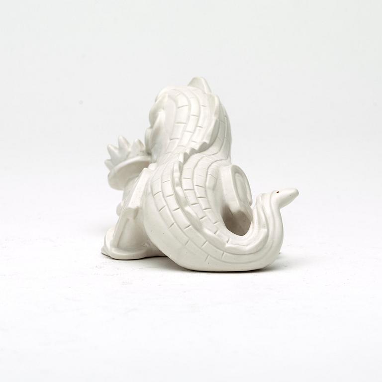 Wilhelm Kåge, a set of stoneware figures of a 'dragon puppy' and two 'dragon puppies' with candle holders, Gustavsberg, ca 1940.