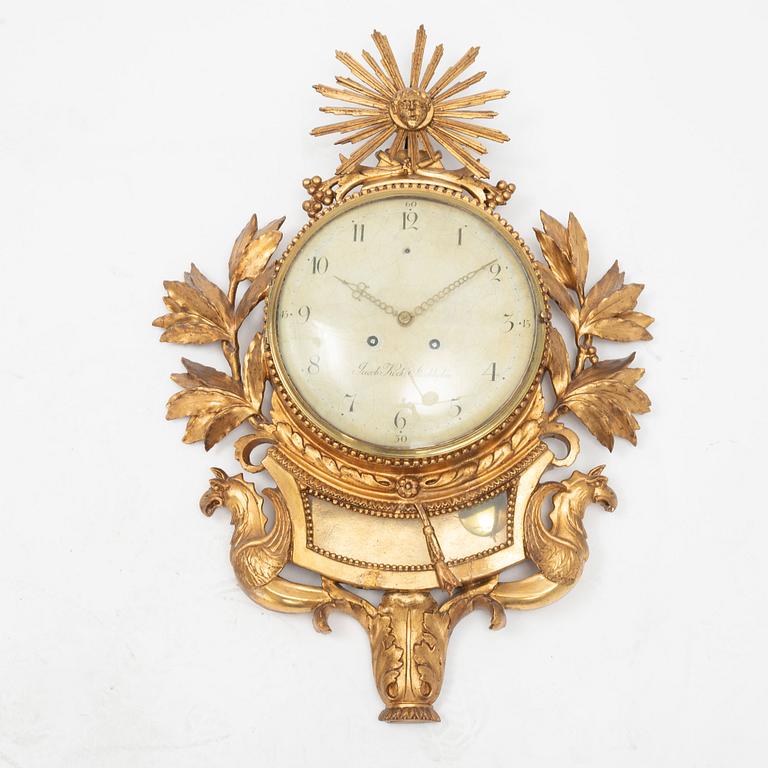 A late Gustavian carved and giltwood cartel clock by J. Kock (royal watchmaker, active 1762-1803).