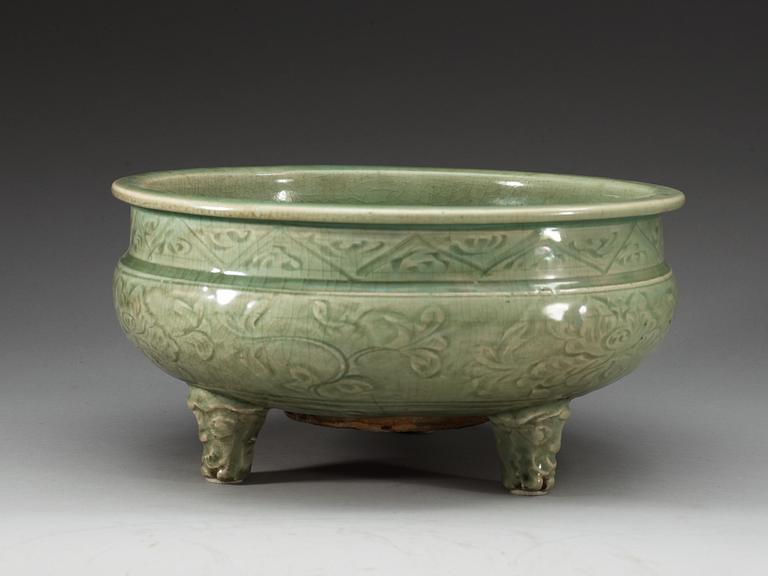 A large celadon tripod censer, Ming dynasty (1368-1644).