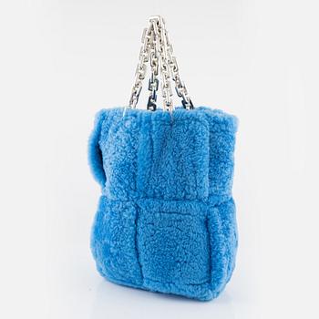 Bottega Veneta, A blue shearling intrecciato 'The Chain Tote'.