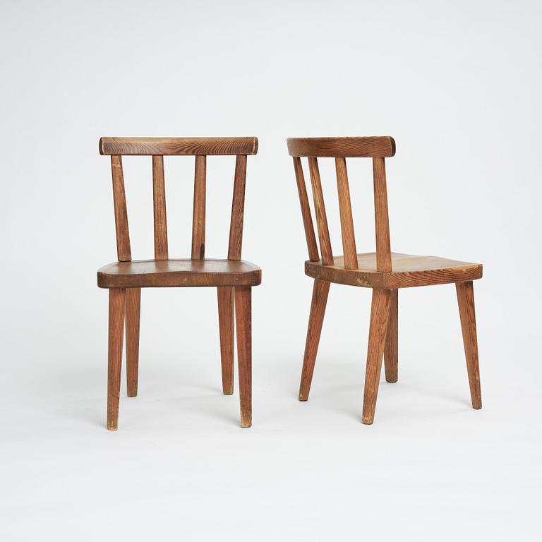 Axel Einar Hjorth, a set of four stained pine "Utö" chairs, Nordiska Kompaniet, Sweden 1930s.