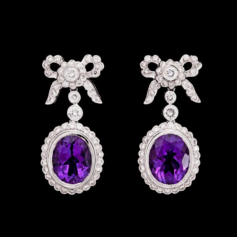A pair of amethyst and brilliant cut diamond earrings, tot. 1.44 ct.