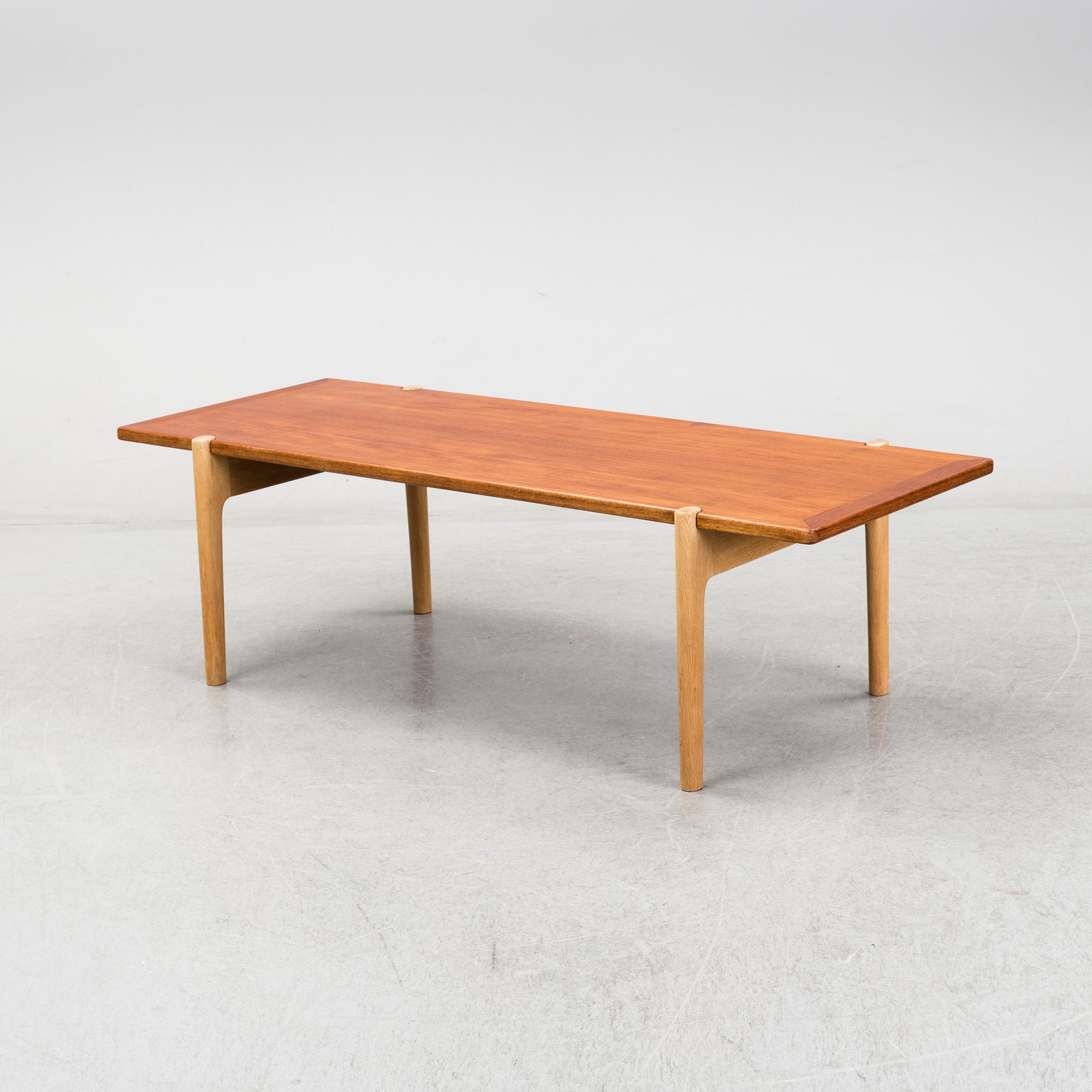 A model JH 575 coffee table by Hans J Wegner for Johannes Hansen.