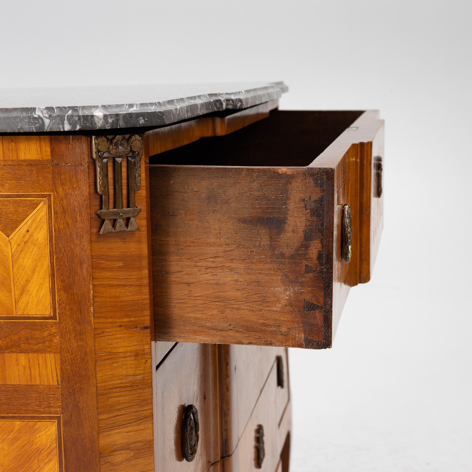 A Louis XVI style chest of drawers, France, circa 1900.