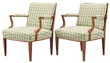 A pair of Josef Frank arm chairs by Firma Svenskt Tenn.