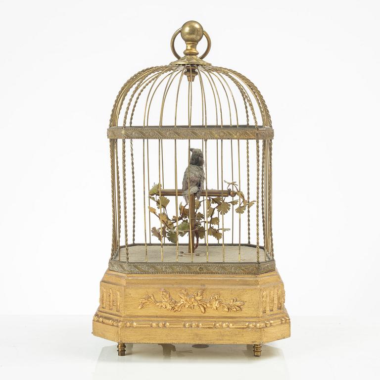 A music box in the shape of a bird's cage, France, late 19th century.