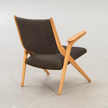 A Swedish oak and teak mid 1900s easy chair.