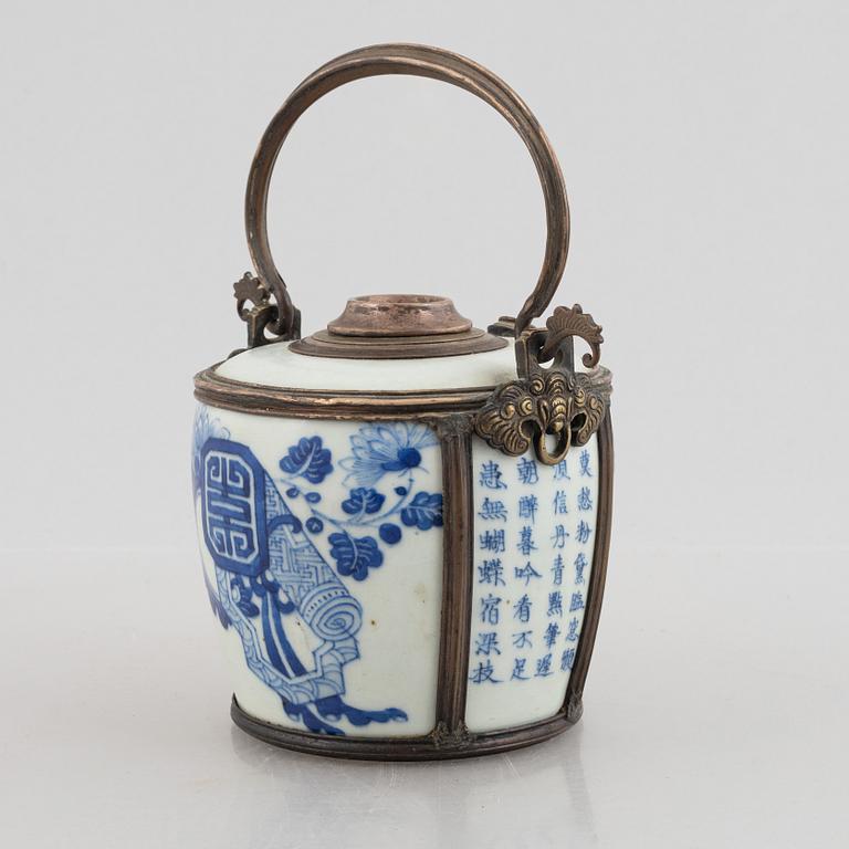 A metal mounted porcelain ewer, late Qing dynasty.