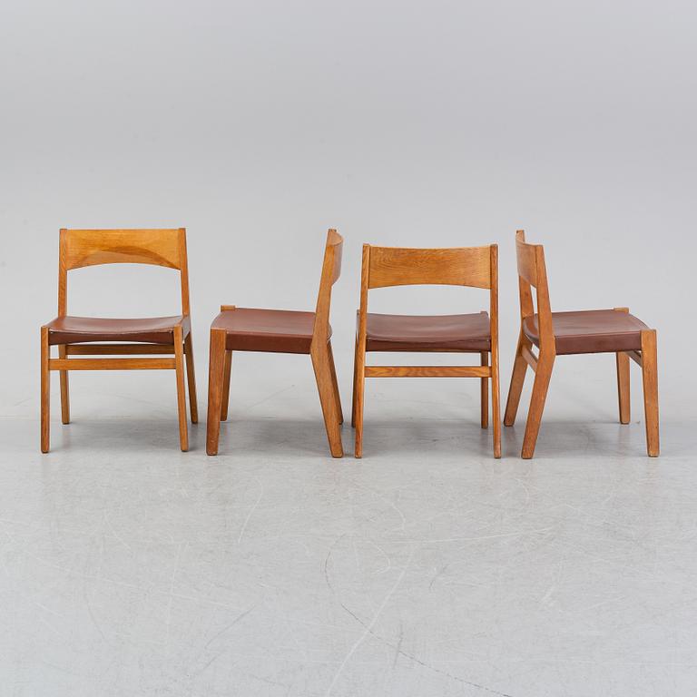 Four oak chairs with leather seat by John Vedel Rieper, Denmark, 1962.