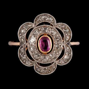 146. RING i form av en blomma med rubin och rosenslipade diamanter, Stockholm, 1933. Vikt ca 3 g.