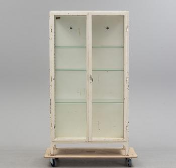 A mid 20th century metal display cabinet.