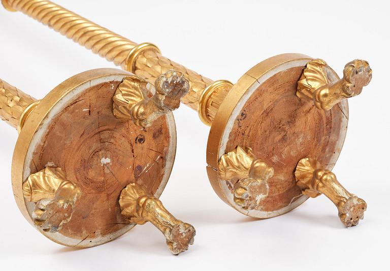 A pair of late Gustavian giltwood torchères by J. Frisk (master in Stockholm 1805-24).