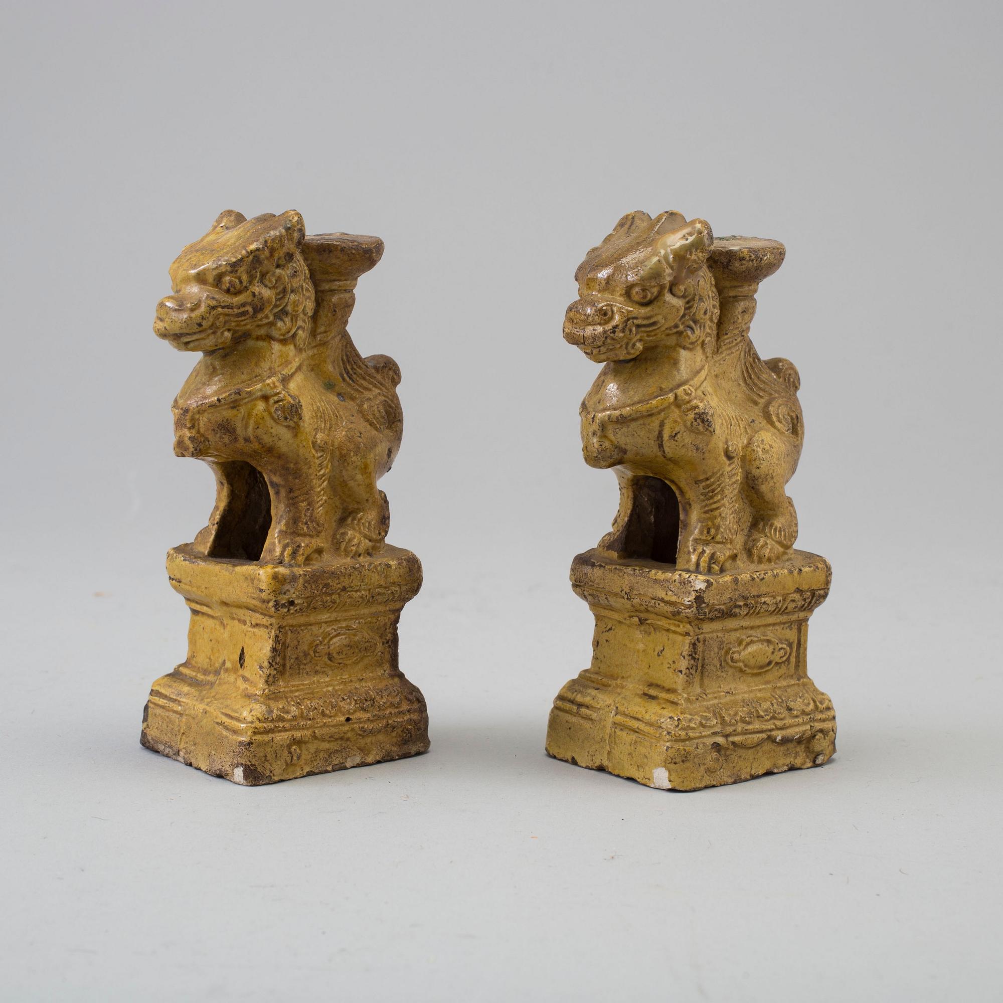 A pair of yellow glazed chinese joss sticks holders, 17th Century.