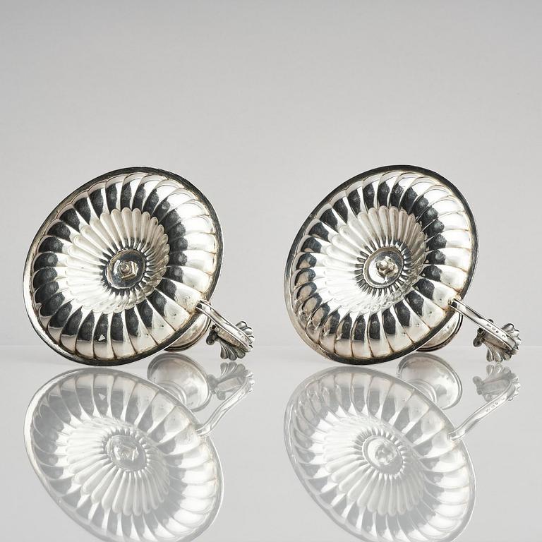 A pair of Swedish 19th century silver chamber-candlesticks, marks of Adolf Zethelius, Stockholm 1831.