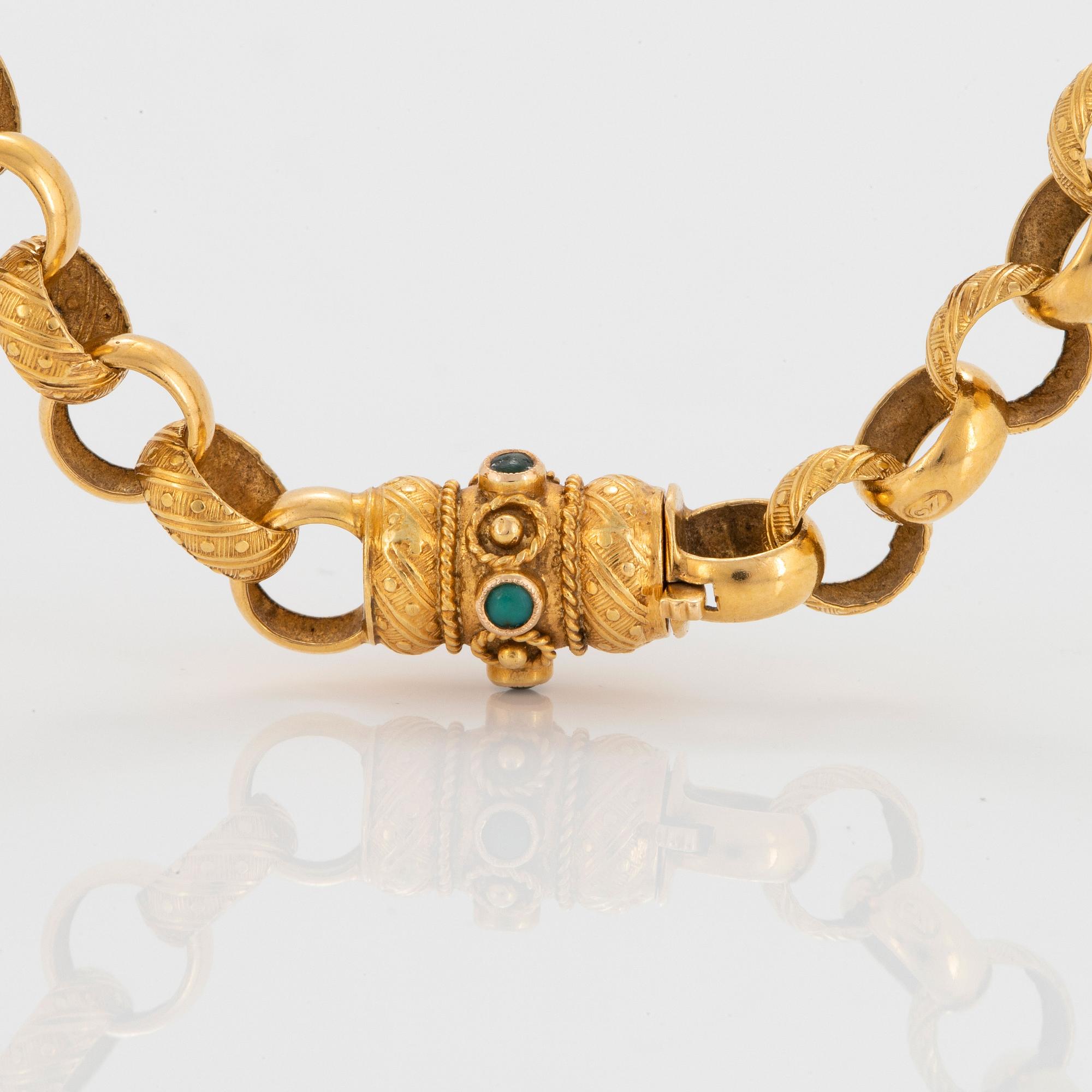 Collier 18K guld med gröna stenar.