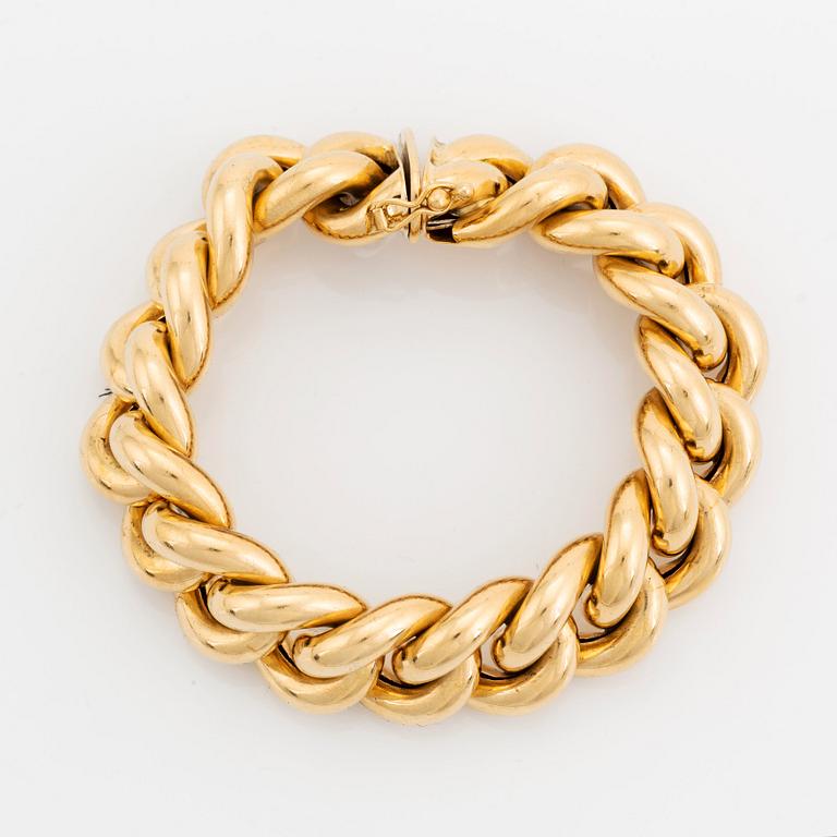 An 18K gold bracelet.