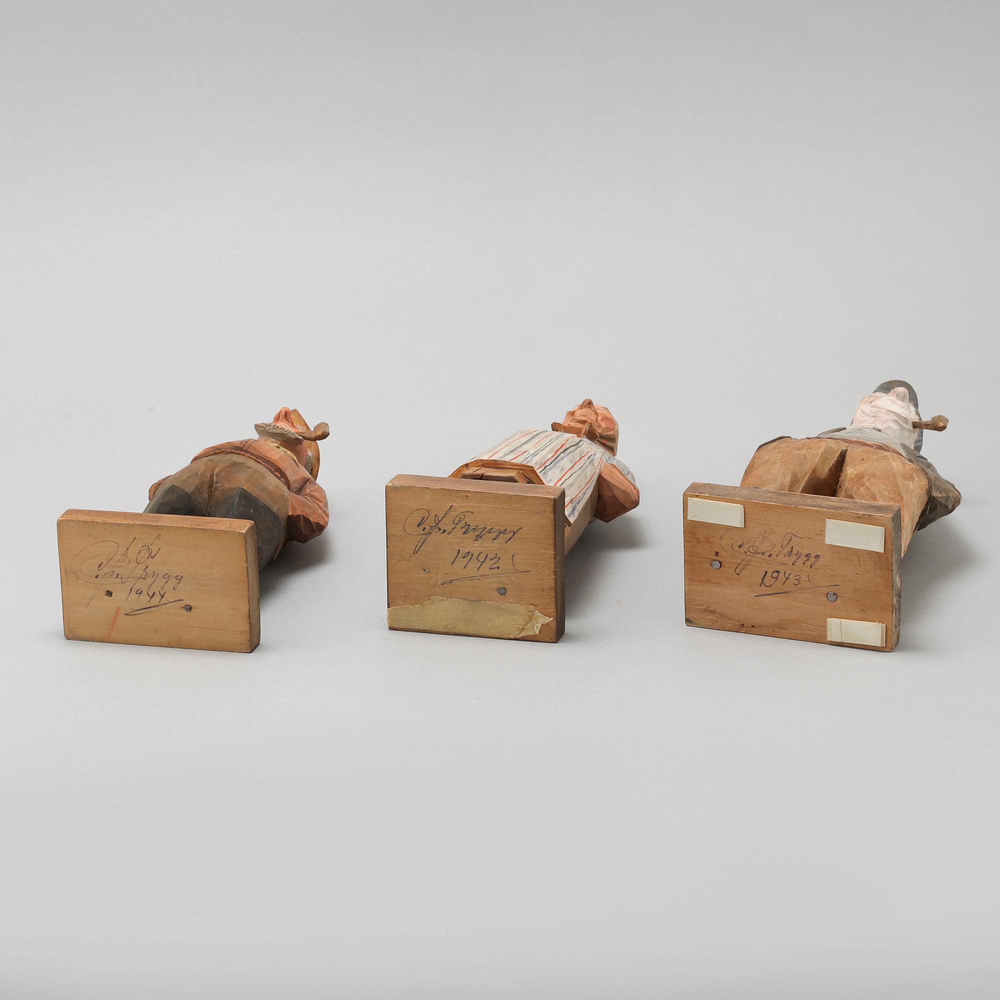 and CARL JOHAN TRYGG, three wooden sculptures, signed and dated, 1940s.