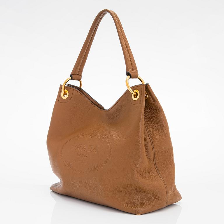 Prada, a "Vitello Phenix" leather bag.