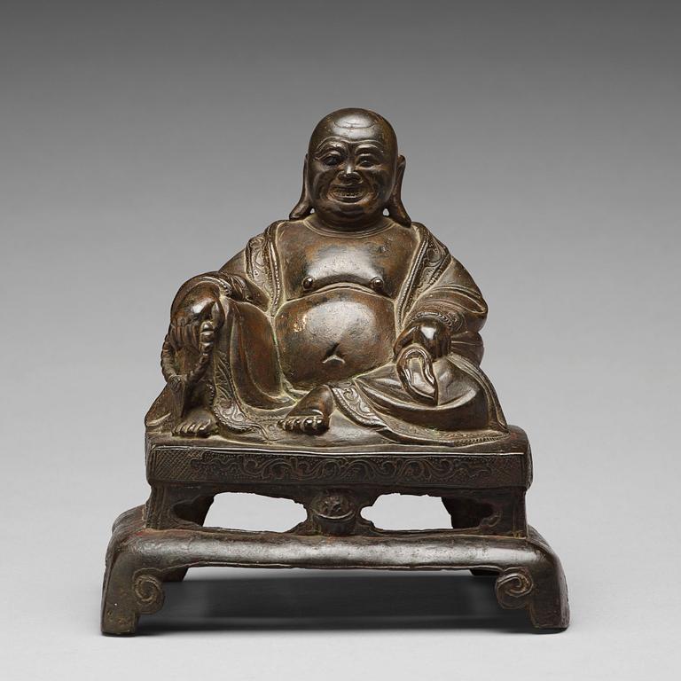 A setated bronze figure of Buddai, Qing dynasty (1664-1912).