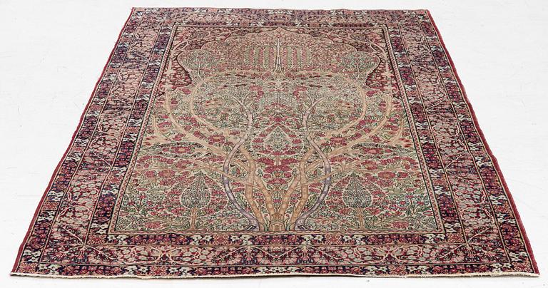 An antique Kirman rug, south Persia, c. 220 x 140 cm.