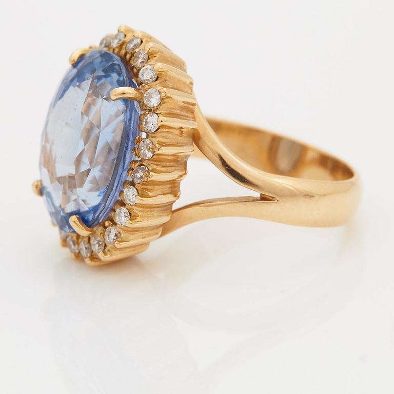 A RING set with a faceted sapphire.