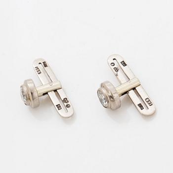 Brilliant-cut diamond shirt buttons.