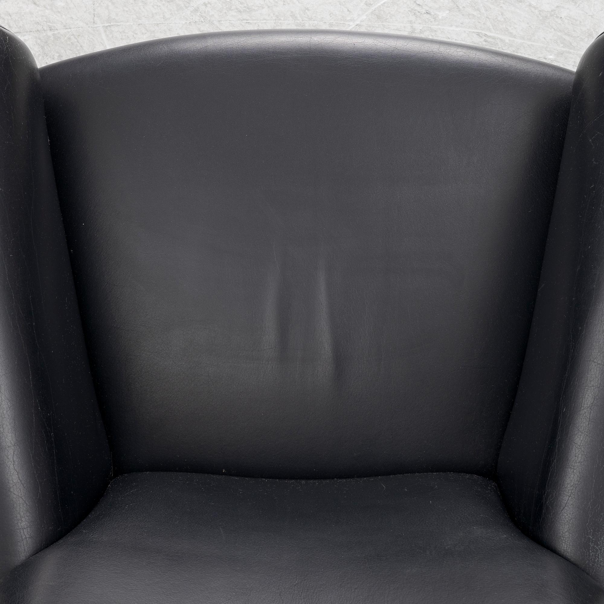 Hans J. Wegner, fåtölj med fotpall, "Ox Chair", EJ-100, Erik Jørgensen Møbelfabrik A/S, Svendborg, Danmark.