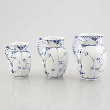 Three 'Blue Fluted Half Lace' / 'Musselmalet' porcelain jugs, Royal Copenhagen, model 562, 561, 763, 1898-1923 and 1962.