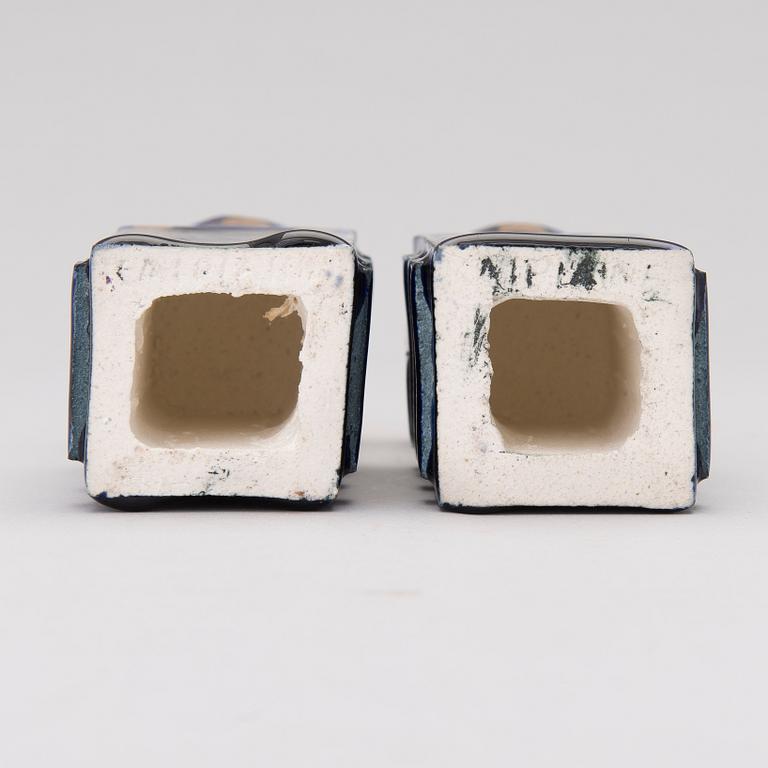 A pair of ceramic candlesticks signed Kaipiainen.