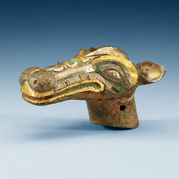 1825. An archaistic bronze handle for a cane in the shape of a mythological animal.