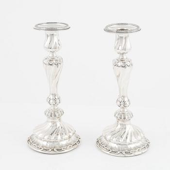 A pair of silver candle sticks by K Anderson Stockholm 1898.