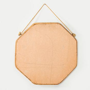 A 1950s rattan mirror.