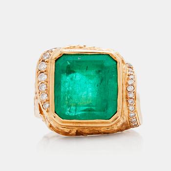 A circa 8.80 ct emerald and brilliant cut diamond ring. Total carat weight of diamonds circa 0.40 ct. Probably 1980's.
