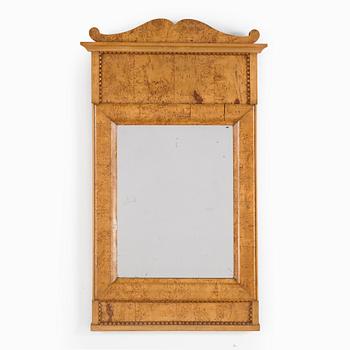A birch veneered Swedish mirror, late empire, mid 19th Century.