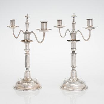 A pair of silver candelabra by Ferdinand Christian Krebs, Breslau, 1776-1792, with snuffers from Reval. Neo-classicism.