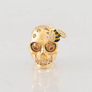 Alexander McQueen, three bracelets and a ring.