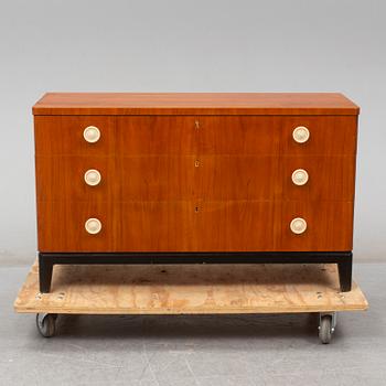 A walnut veneered chest of drawers, 1930's.