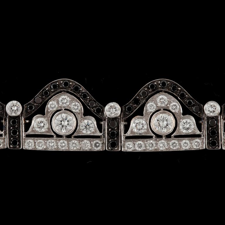 A black and white diamond bracelet. Total carat weight 6.89 cts.